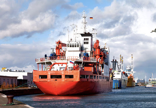 Lead-Marine-Staffing Large Industrial Boat docked next to other large boats